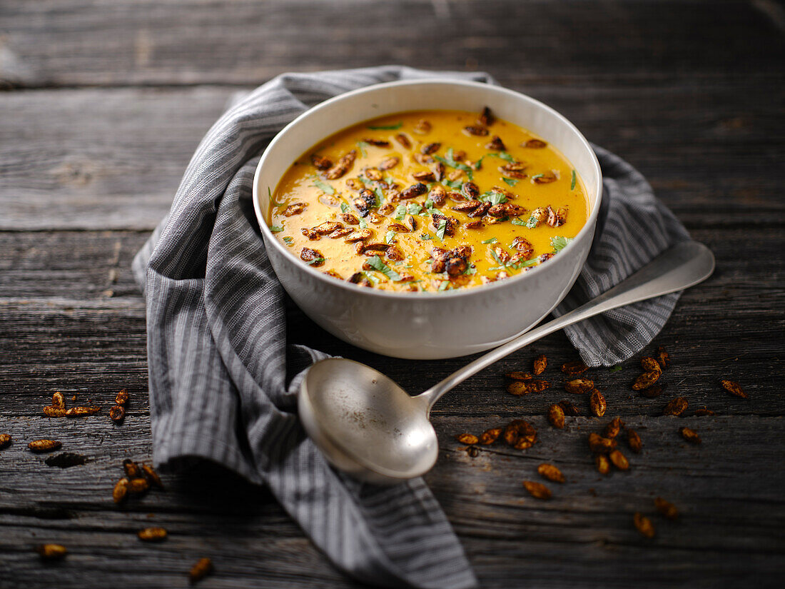 Cream with pumpkin soup with spicy squash seeds