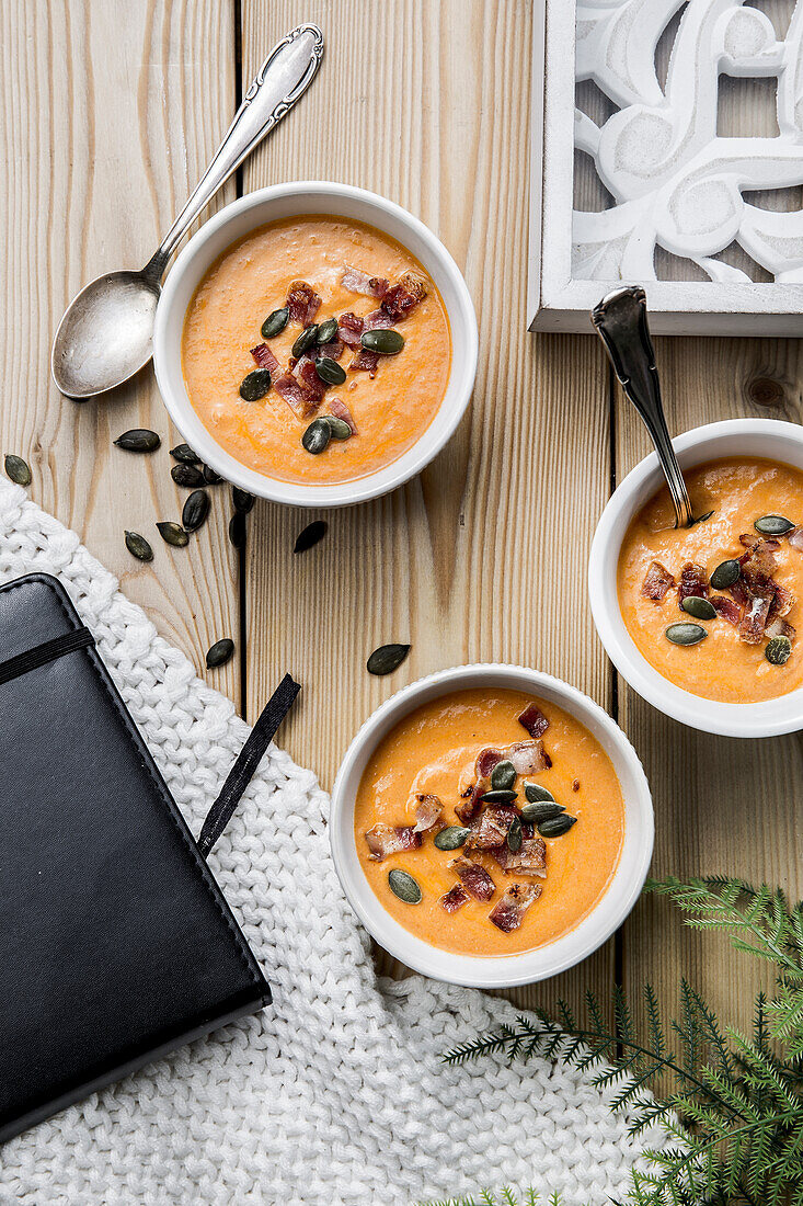 Butternut squash soup with roasted bacon and pumpkin seeds