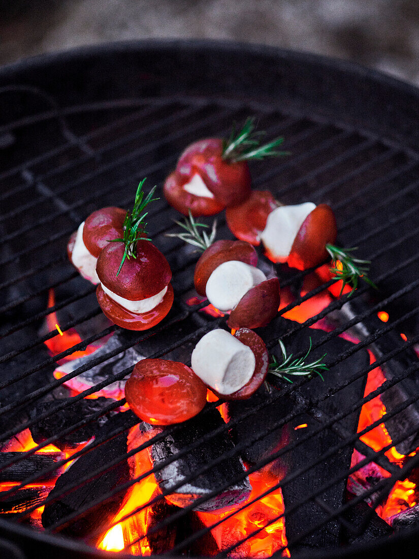 Apricots with marshmallows and rosemary on the barbecue