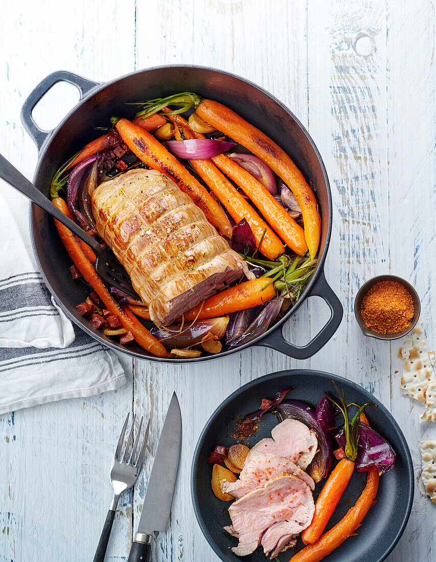 Roast veal with carrots in a casserole