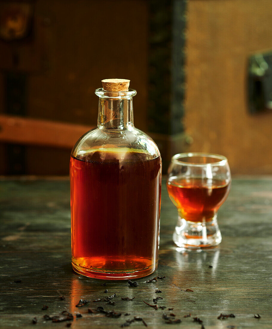 Bottle of Rum with smoked tea and sesame syrup