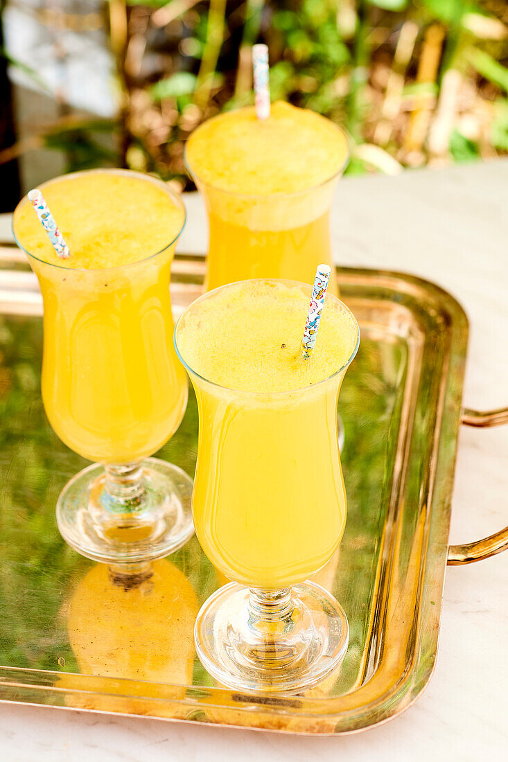 Pineapple granita cocktail on golden tray