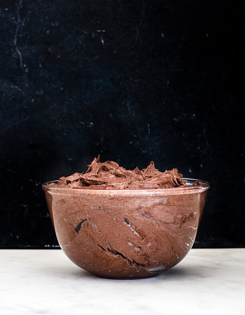 Chocolate buttercream in a glass bowl