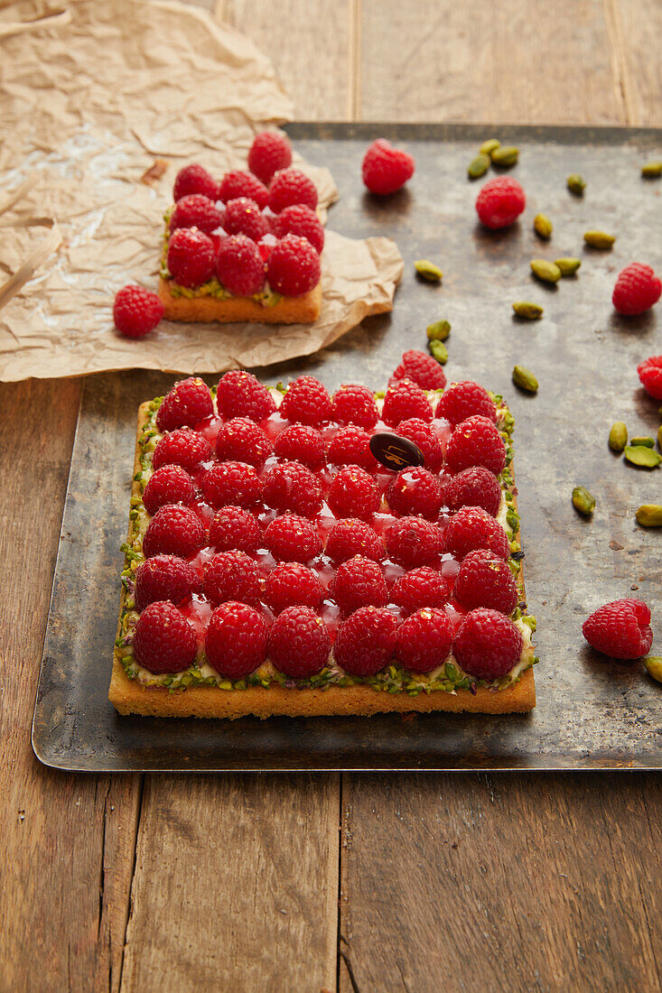 Square raspberry and pistachio shortbread tart