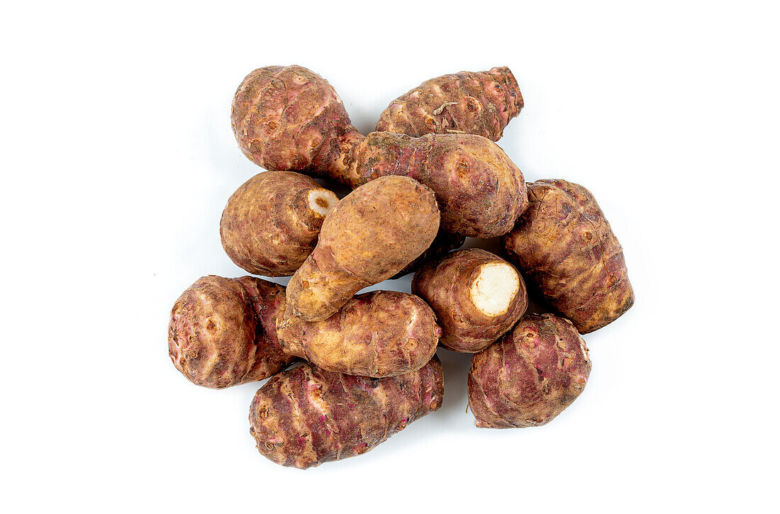 Jerusalem artichokes on a white background