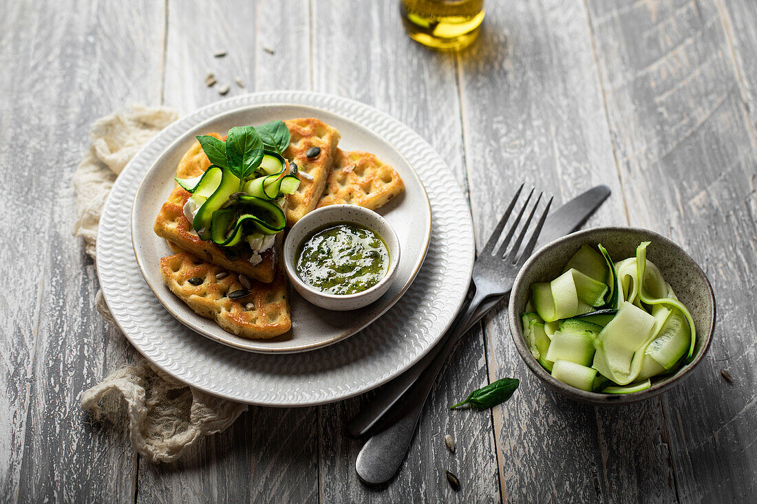 Waffle with zucchini, goat cheese and pesto