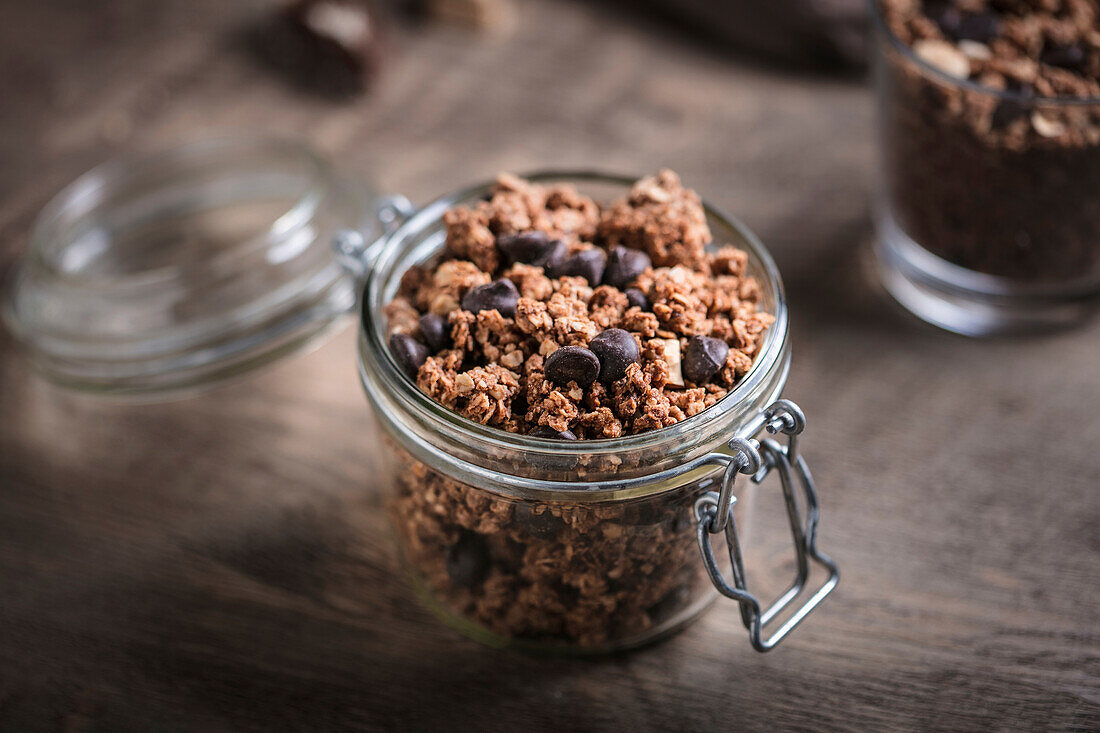 Granola muesli with chocolate in a glass jar