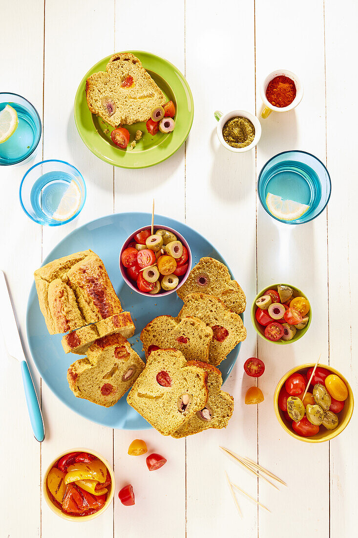 Chickpea flour cake with cherry tomatoes and green olives