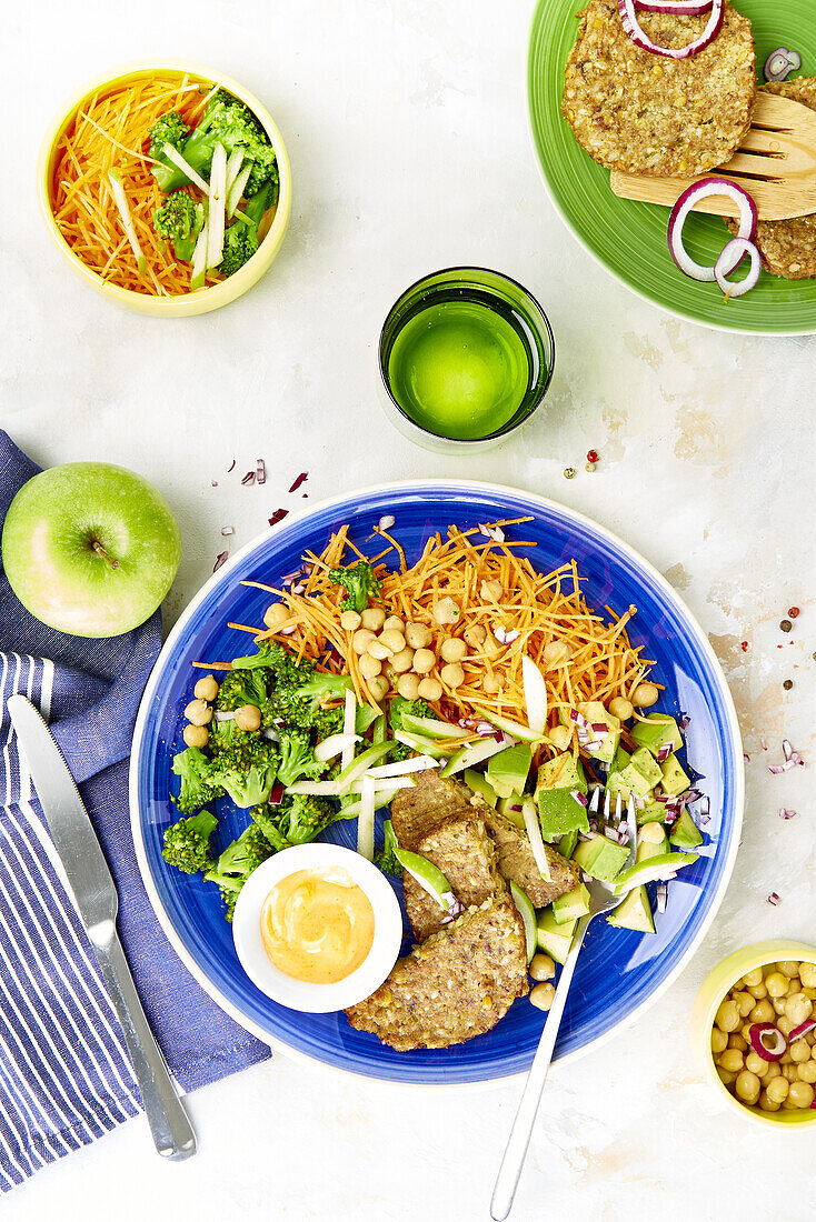Chickpea patty with grated carrot, broccoli and avocado