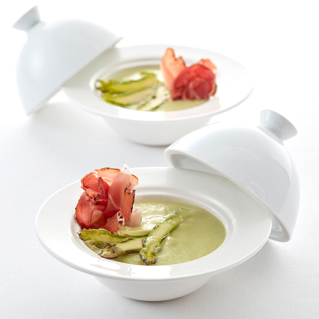 Cream of green asparagus soup with crisp prosciutto