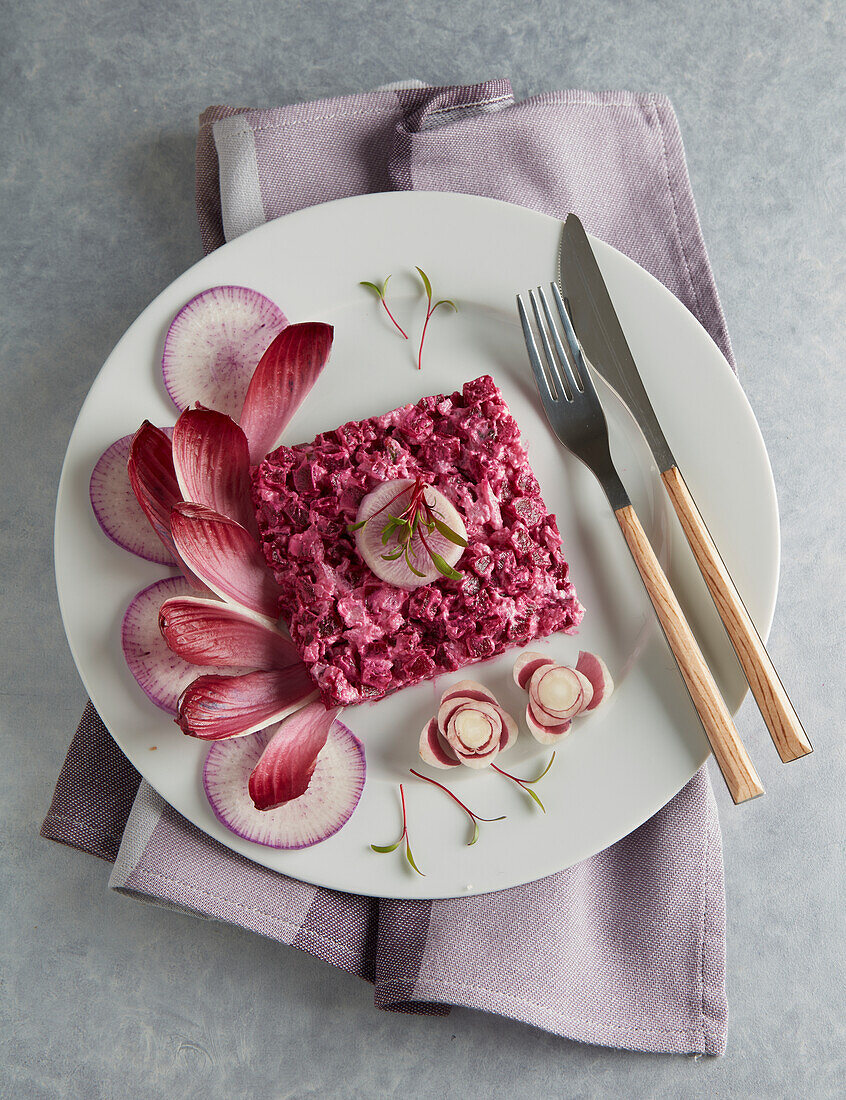 Beetroot tartare arranged decoratively on a plate