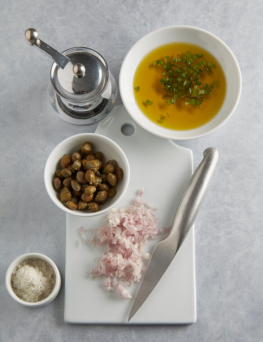 Preparing leeks mimosa : preparing caper,shallot and chopped herb sauce