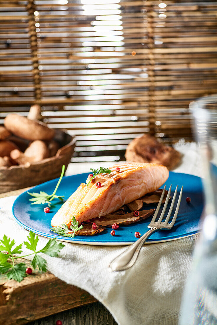 Salmon steak with porcini mushrooms and red pepper