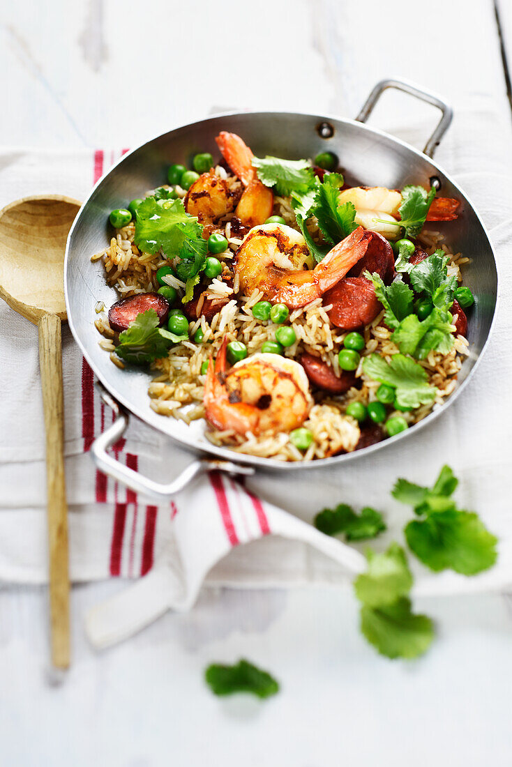 Fried rice with shrimps, chorizo, peas and coriander