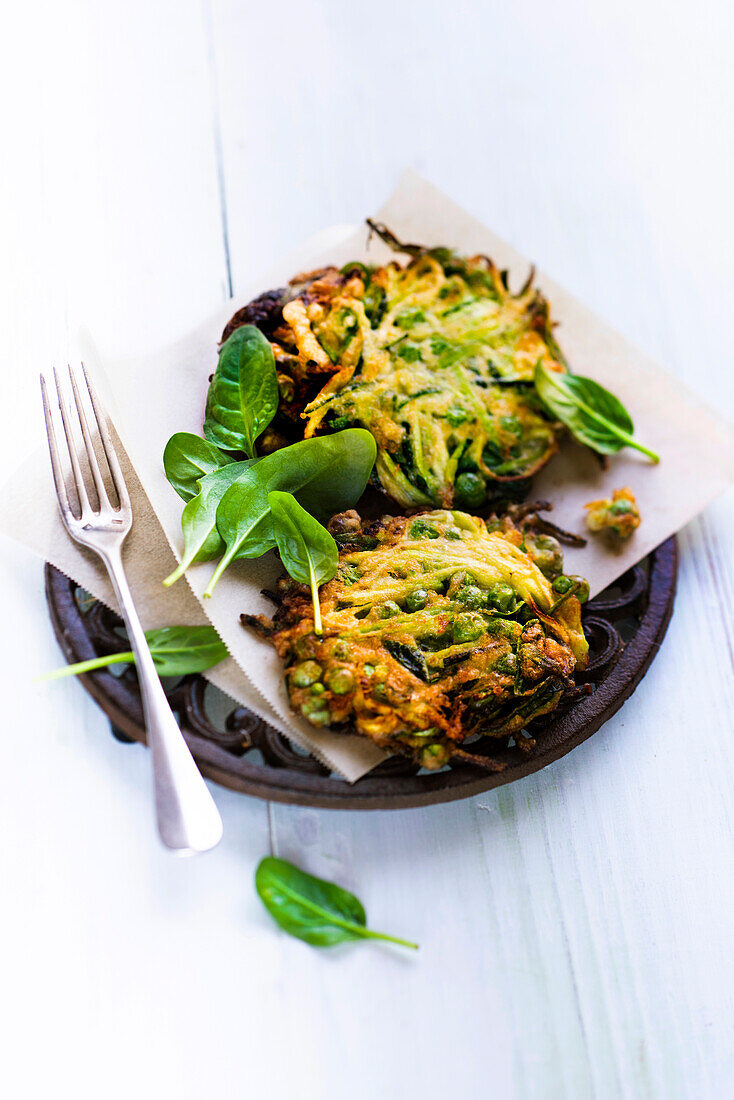 Fritters with peas, spinach, zucchini, and parmesan