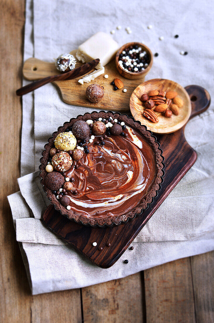 Chocolate tart decorated with various chocolate balls