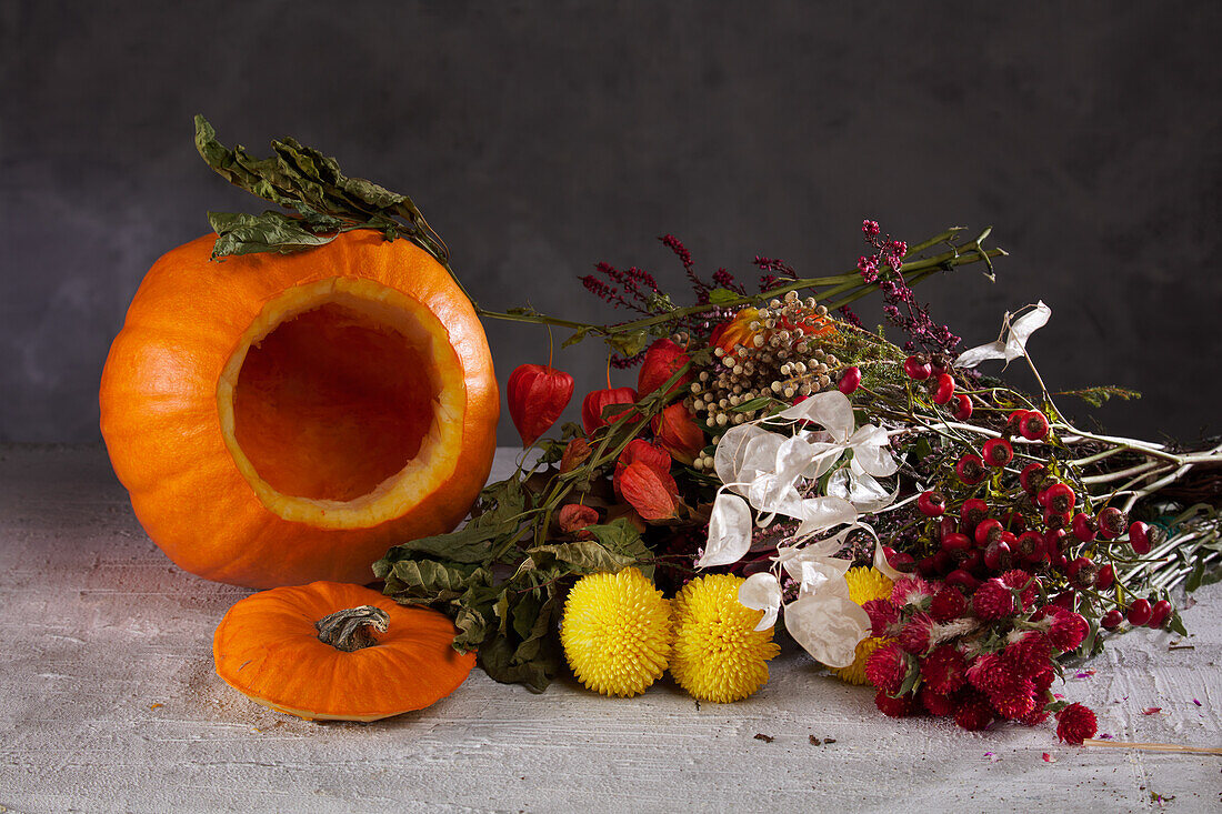 Accessories for Halloween flower arrangement: dried flowers and hollowed pumpkin