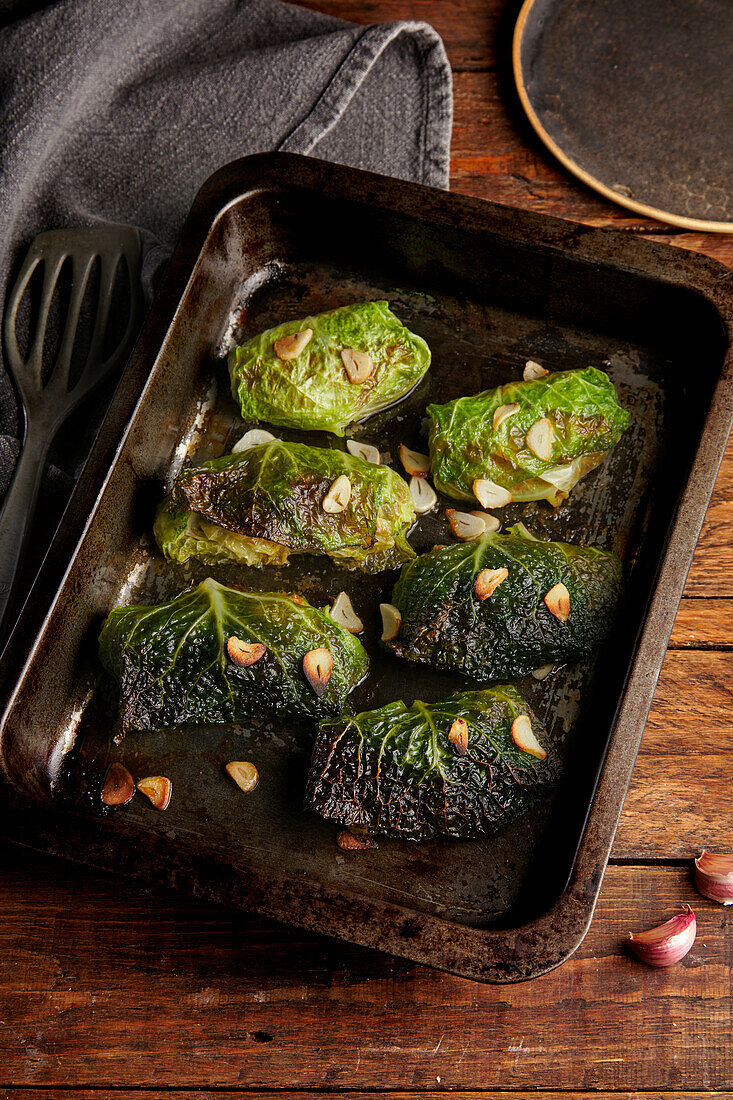 Stuffed savoy cabbage roulades with garlic