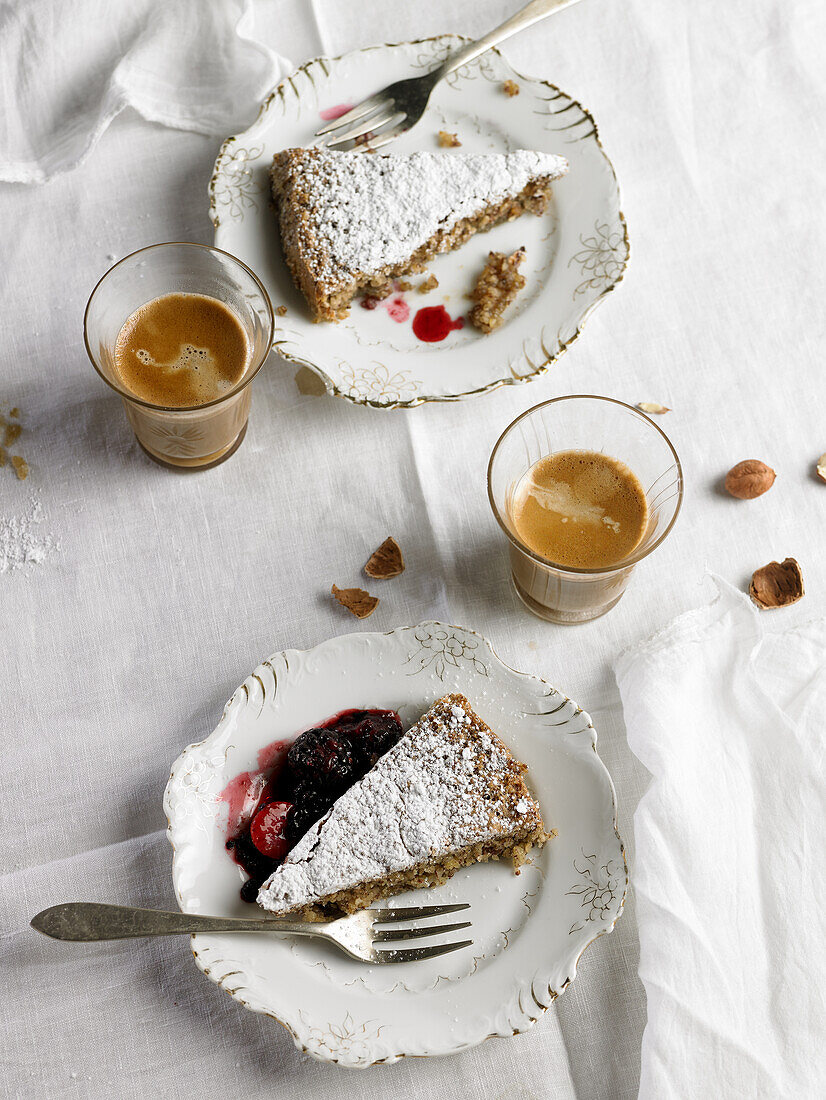 Almond cake from Santiago de Compostela with coffee in a glass (Galicia, Spain)