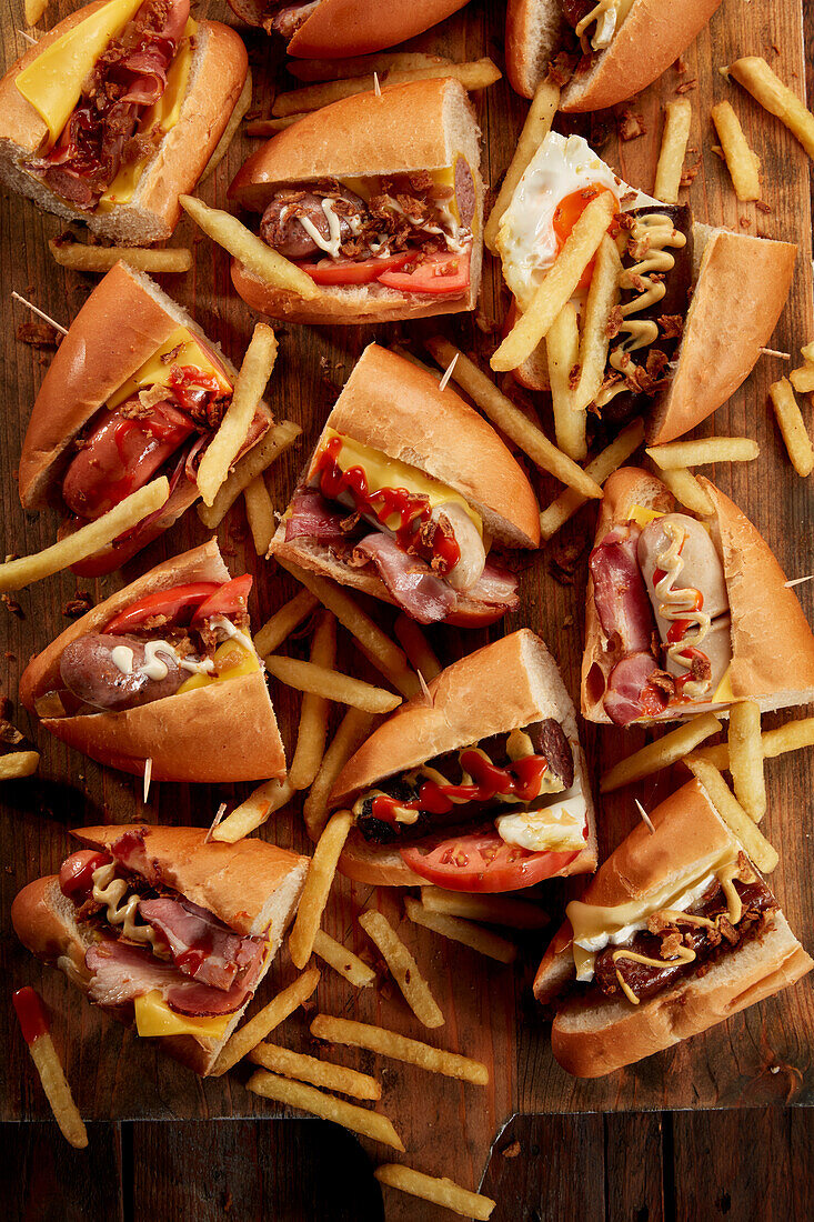 Assorted hot dogs cut in half and served with french fries