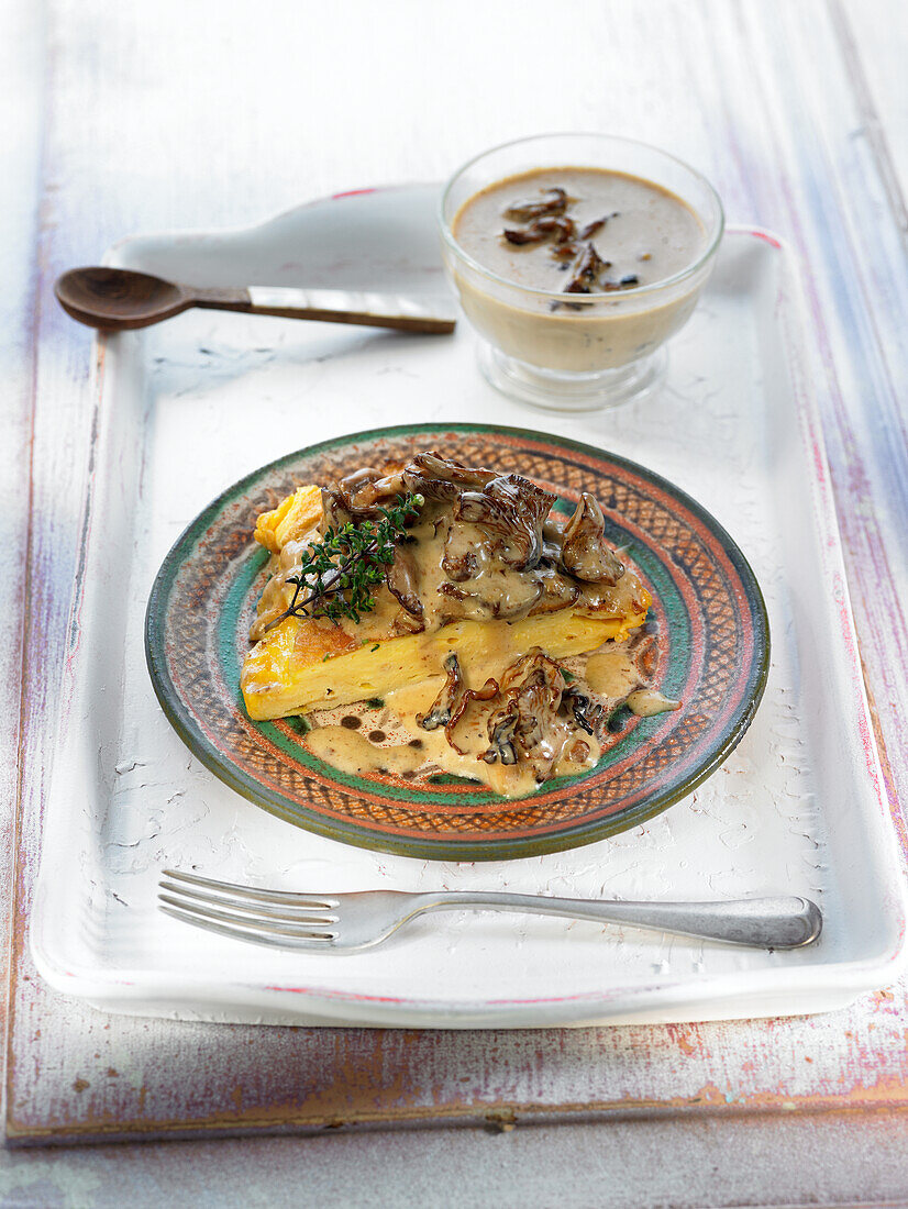 Potato omelette with Iberico ham and mushroom sauce