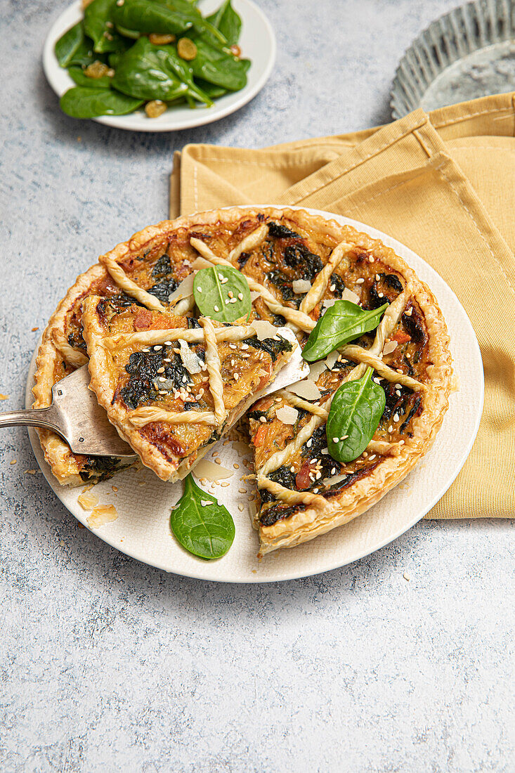 Quiche with confit rabbit, carrots, and spinach