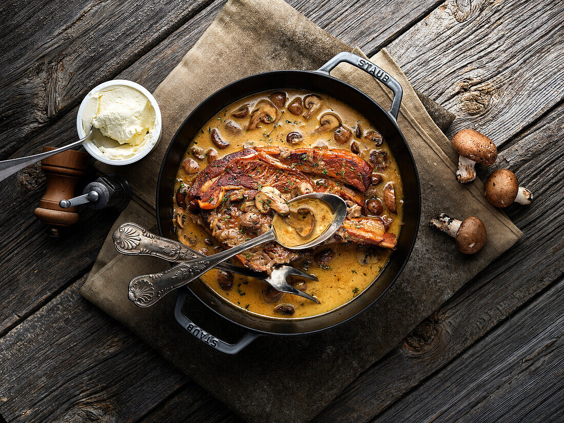 Veal cutlet with mushrooms in sauce (Normandy, France)