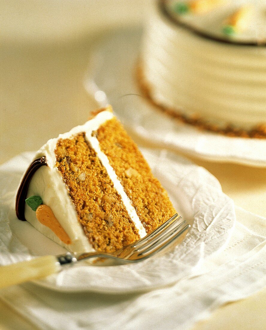 Carrot Cake Slice; Whole Cake in Background