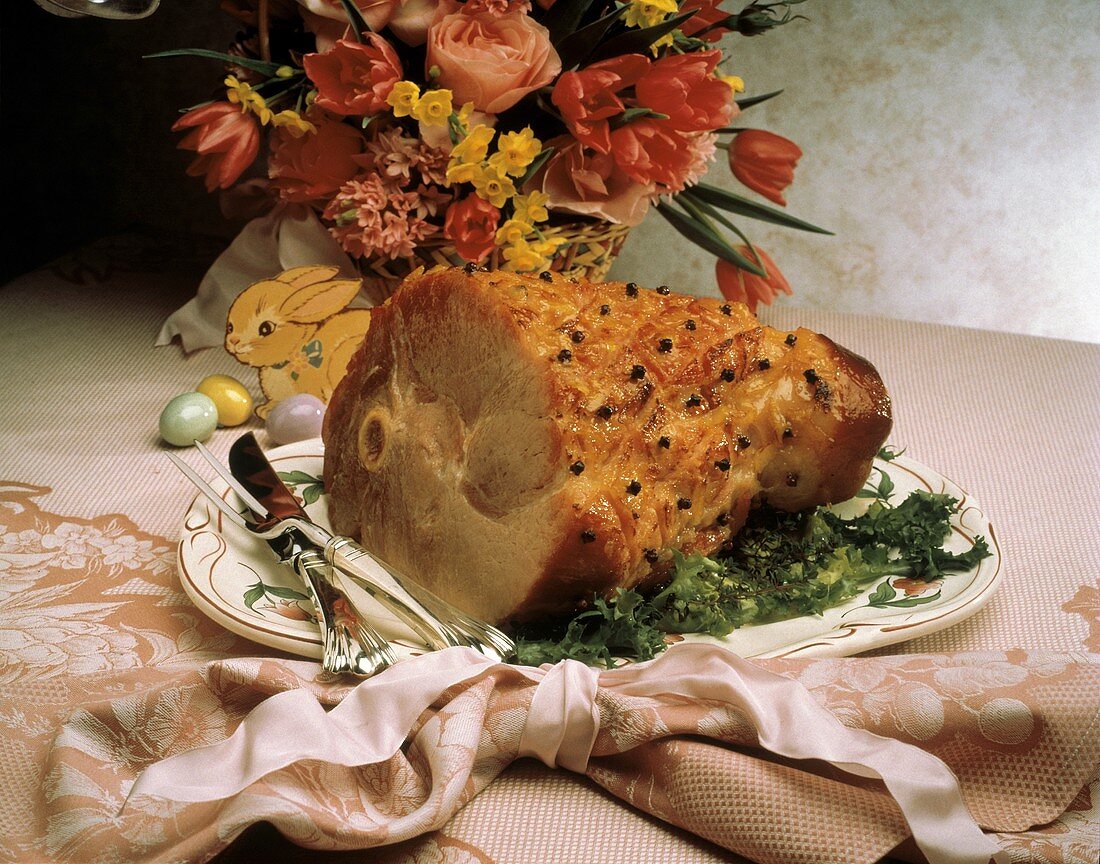 Whole Ham with Cloves and Easter Decorations