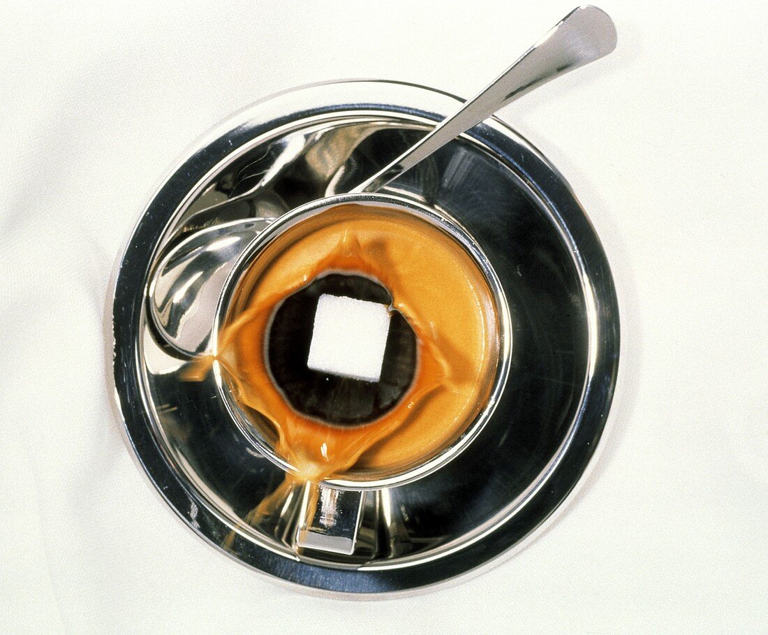 Sugar Cube Splashing into Cup of Espresso