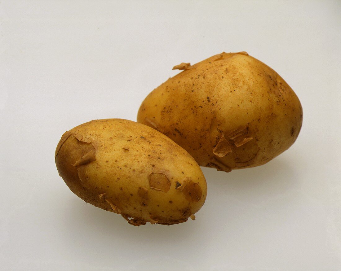 Two Fresh Whole Potatoes