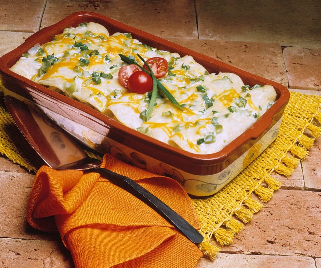 Enchiladas in Casserole Dish with Melted Cheese