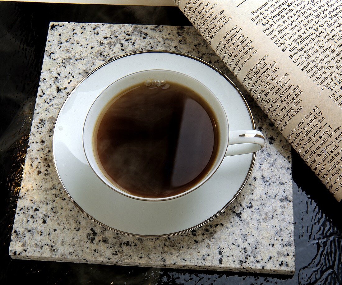 Cup of Coffee with Newspaper