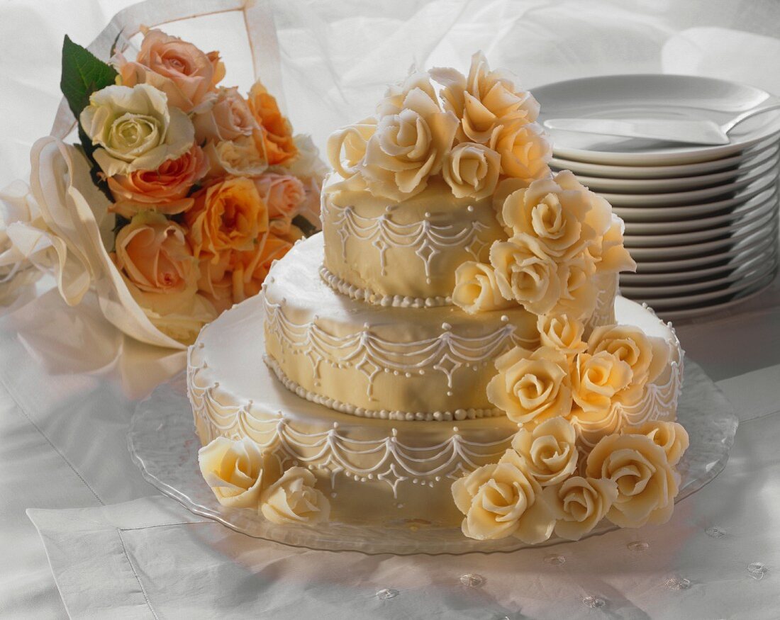 Three Tier Wedding Cake; Flowers; Plates and Cake Server