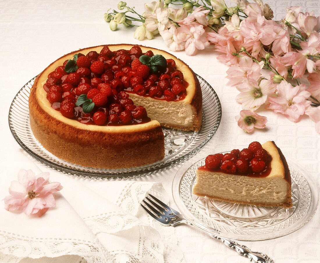 Cheesecake and slice with raspberry topping