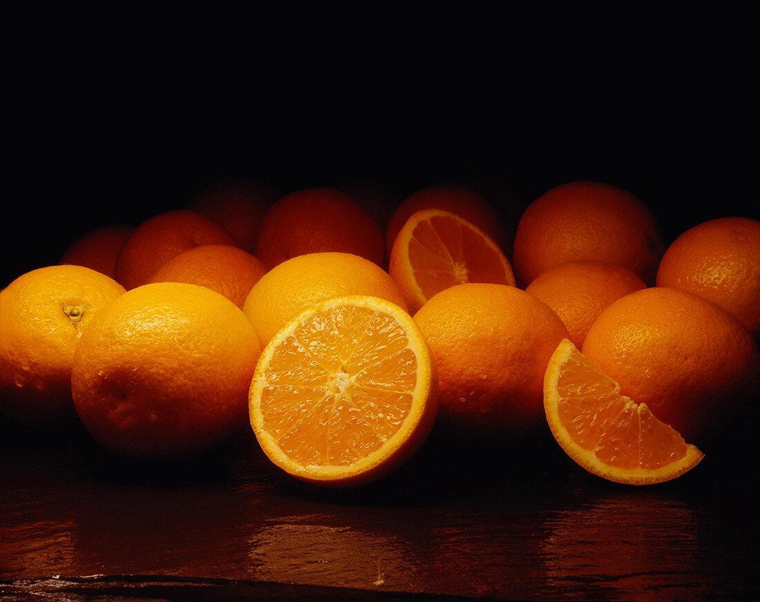 Several Oranges Whole and Cut