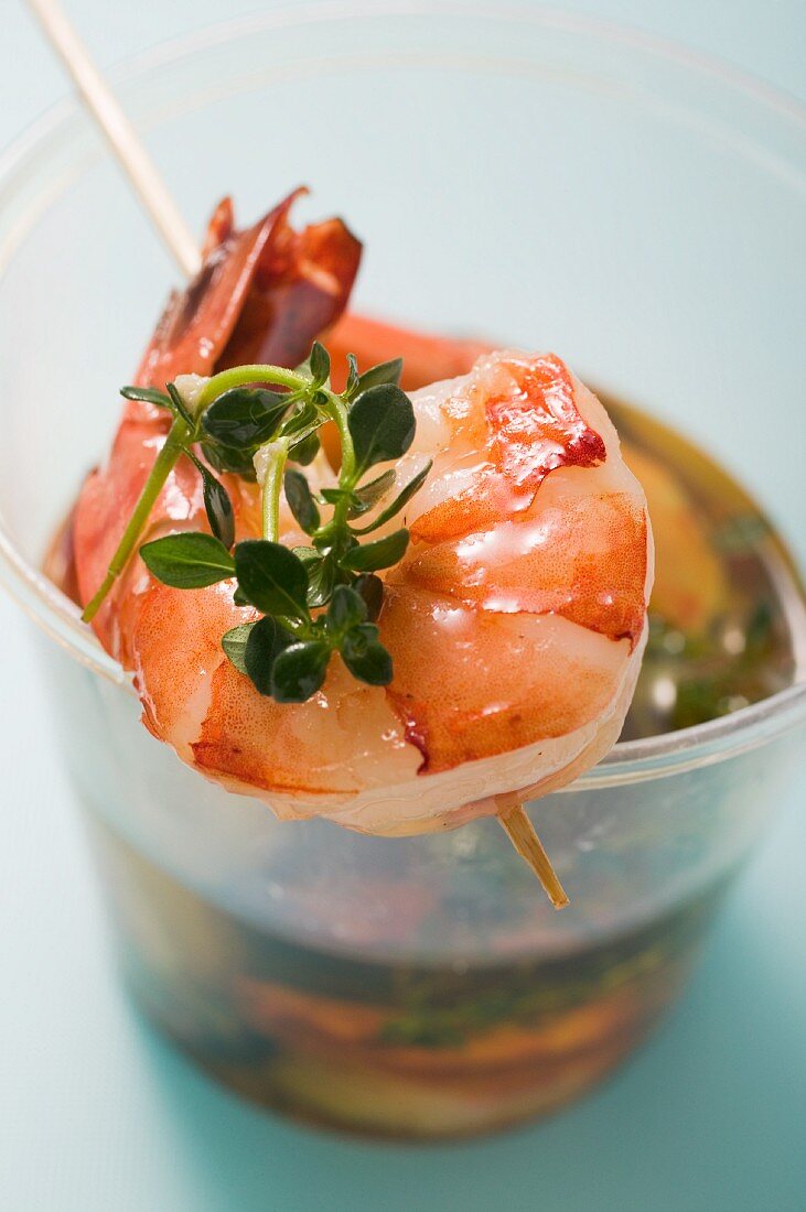 Marinated prawns with oregano on tooth picks (close-up)