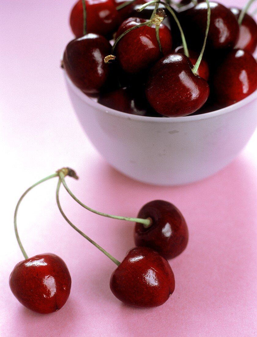 Three Fresh Red Cherries; Bowl