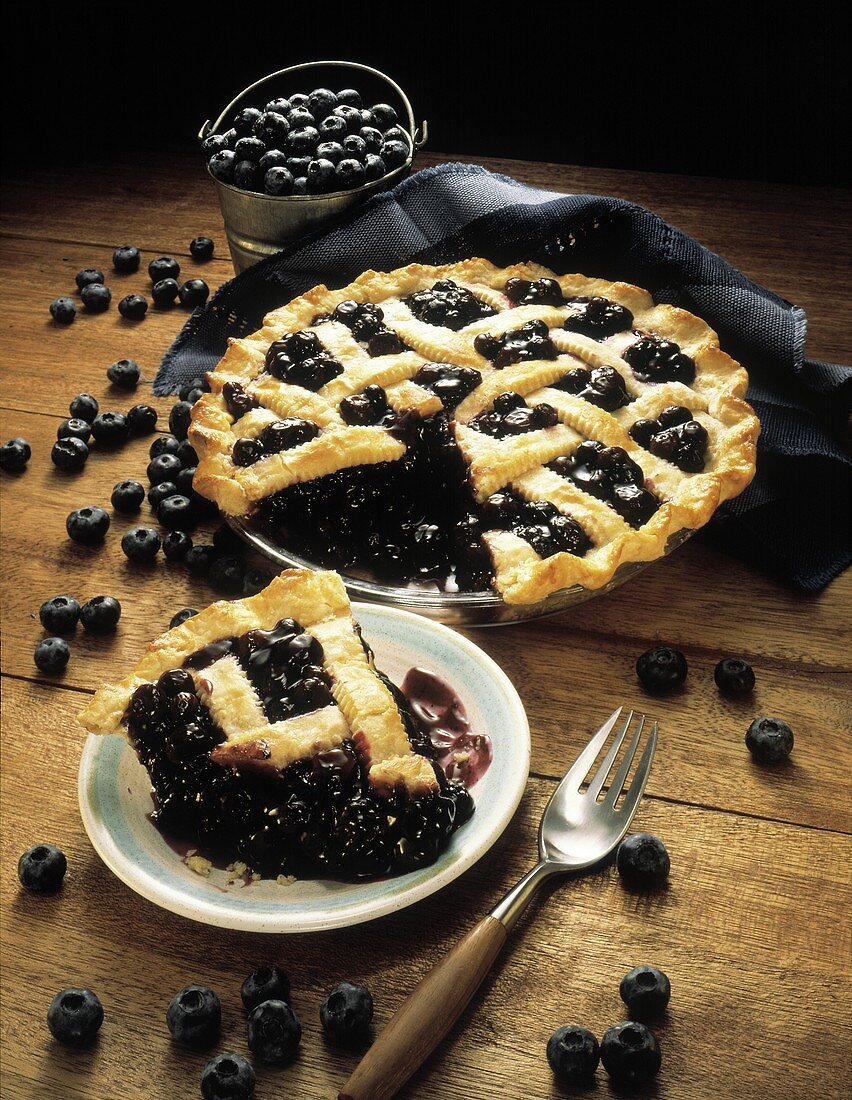 A Piece of Blueberry Pie with Whole Pie