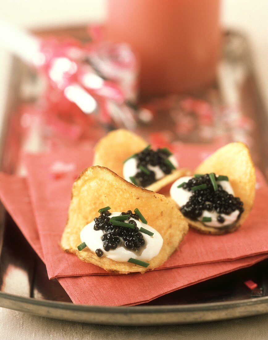 Potato Chips topped with Caviar and Sour Cream
