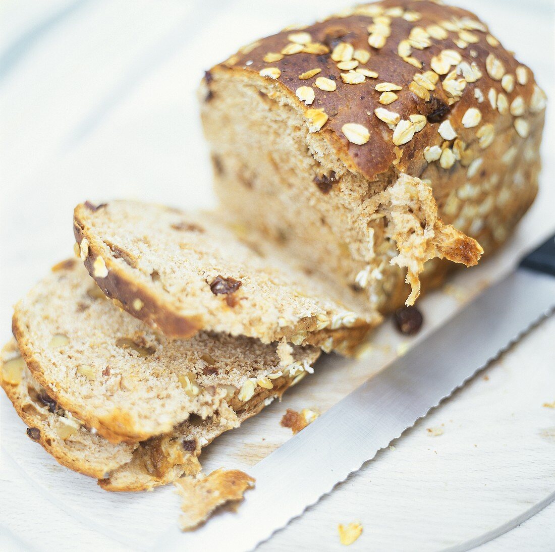 A Loaf of Raisin Nut Bread; Partially Sliced