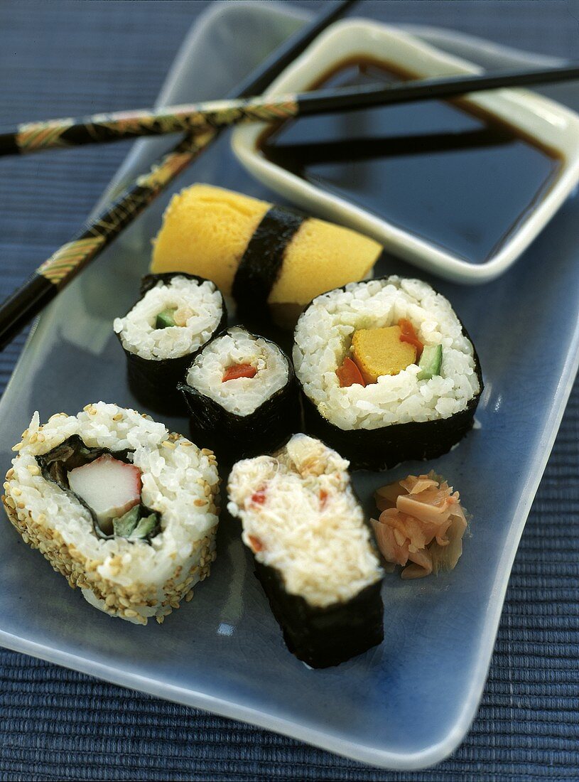 Sushi with Chopsticks and Sauce