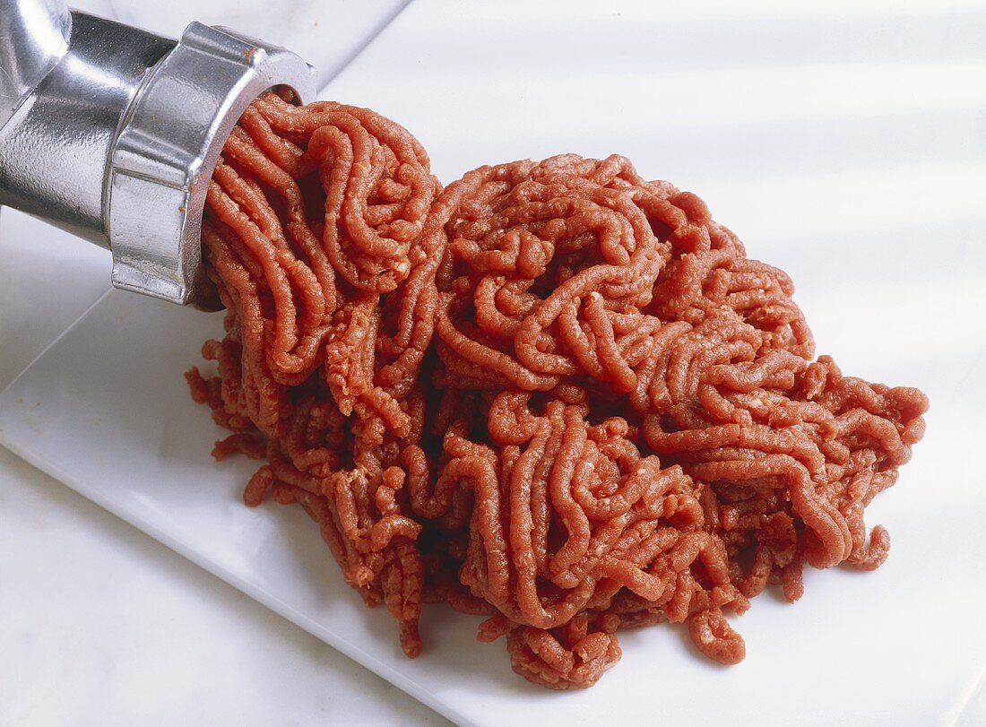 Mincing meat in a mincer