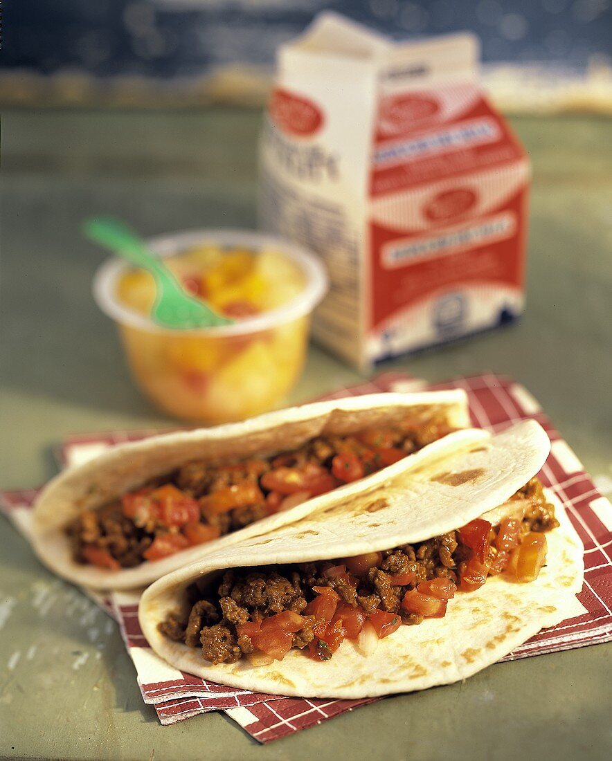 Tortillas with spicy minced beef and tomato filling