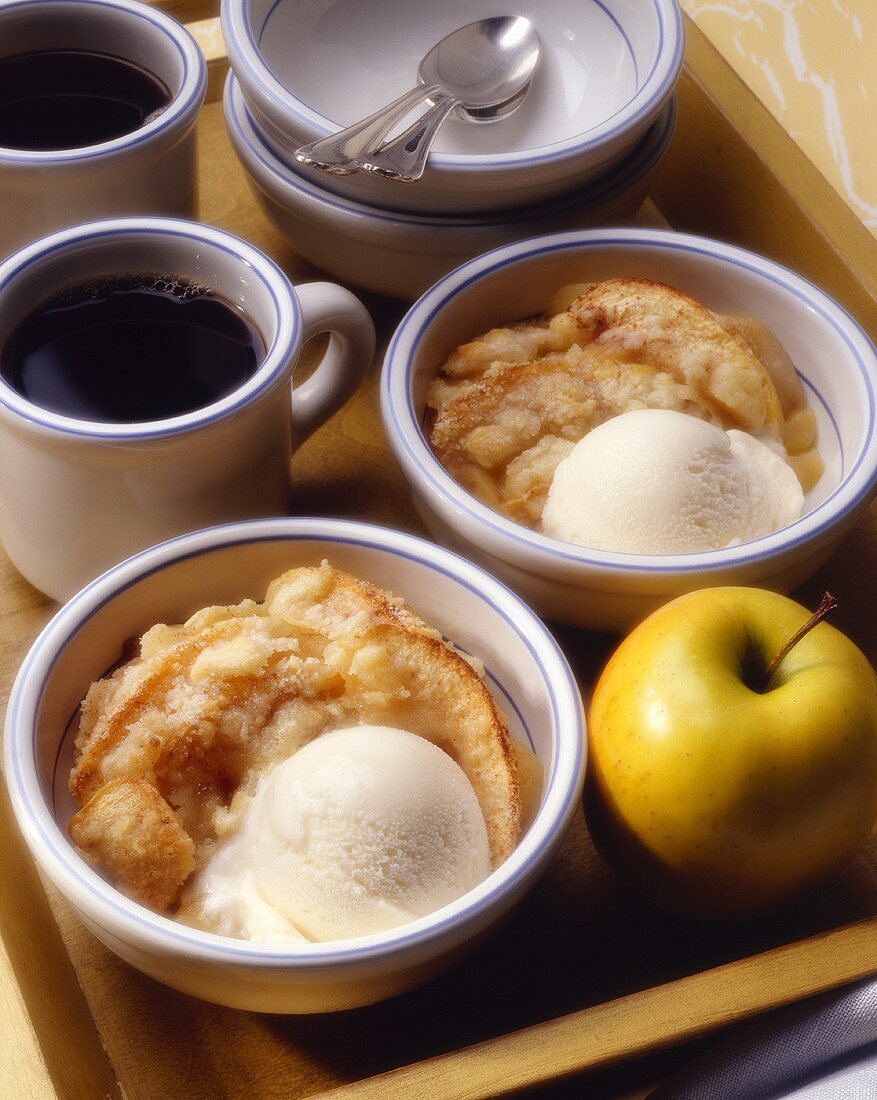 Two Bowls of Apple Crisp with Ice Cream and Coffee