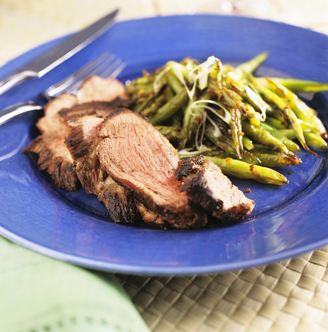 Sliced Grilled Butterflied Leg of Lamb with Roasted Green Beans