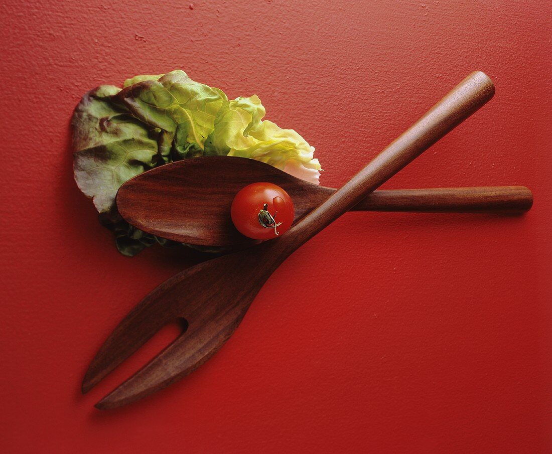 Salad Utensils with Lettuce Leaf and Tomato