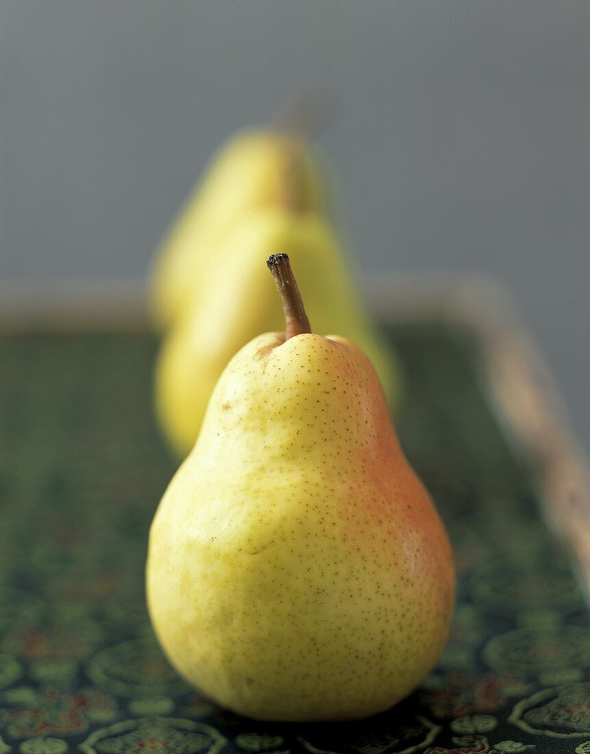 Trio of Yellow Pears on Green Asian Mat