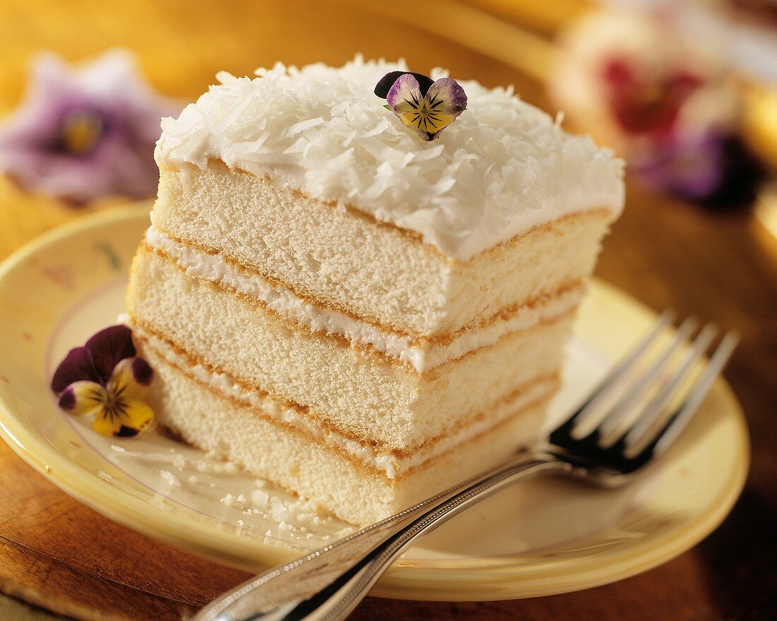 Slice of White Layer Cake with Coconut Frosting