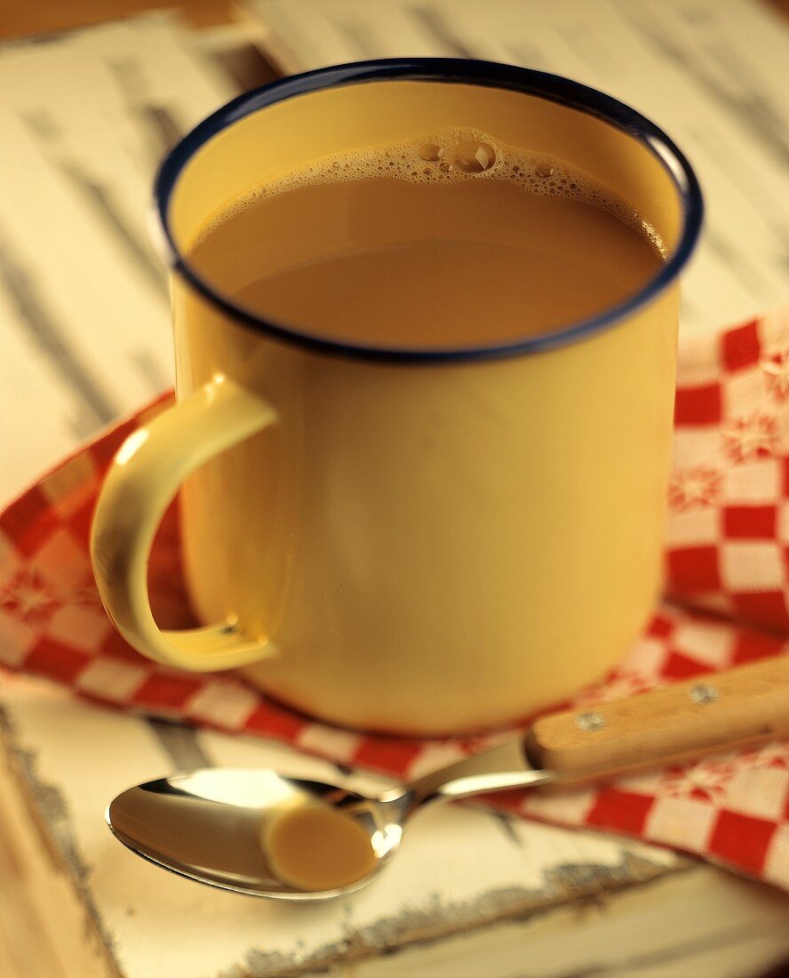 Coffee with Cream in a Metal Mug